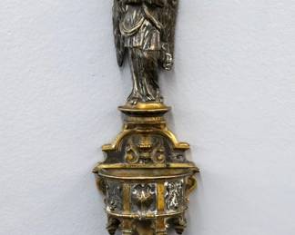 A 19th century French Bronze hanging holy water font by Victor Paillard, French, 1805-1886.  Features an Angel above a basin with cast Shield and Cherub masks.  Impressed "VP" with Crown maker's mark at back.  Some wear to patina and build-up, minor pitting.  11" high.