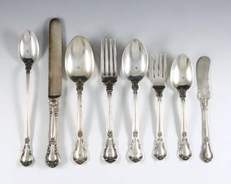 One-hundred and six pieces of Gorham "Chantilly" pattern Sterling Silver flatware.  Features 12 complete five-piece place settings plus additional flatware and serving utensils.  Includes 12 hollow handle dinner knives (8 x 8 3/8" blunt blade knives and 8 x 8 3/4" modern blade knives), 12 x 5 7/8" butter knives, 12 x 6 3/4" dinner forks, 8 x 5 7/8" salad forks, 12 oval soup spoons (9 x 7" spoons and 3 x 6 3/4" spoons), 20 x 5 3/4" teaspoons, 7 x 7 3/8" iced tea spoons plus 23 pieces of additional flatware and serving utensils.  Each with impressed Gorham maker's marks and "Sterling".  98.81 troy ozs plus 13 hollow handles, approx. 106.31 total.  Some wear and tarnishing, many monogrammed, some mismatched styles/sizes.  
