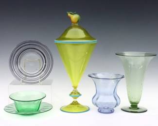 Six pieces of 20th century Art Glass.  Includes a trumpet vase, threaded plate, finger bowl with underplate and a ribbed optic vase attributed to Steuben, with Murano style covered jar with Pear form finial.  Blue vase, finger bowl and threaded plate with "Steuben" acid etched marks.  Some surface wear, minor losses to threading.  Up to 14" high. 
