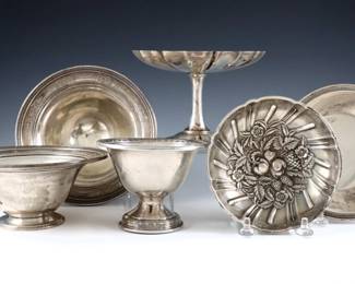 Six American Sterling Silver dishes.  Includes a compote, four footed bowls and a low bowl by various makers.  Each marked "Sterling".  21.07 troy ozs total.  Some surface wear and minor denting.  Up to 6" diameter and 4" high.  

