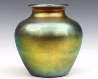 An early 20th century Steuben Gold Aurene Art Glass vase.  Shape #2683 with bulbous body with flared rim.  Signed "Steuben Aurene" and "2683" (partially worn).  Minor surface wear, flake at rim.  Approx. 7 1/2" diameter x 7 3/4" high.  
