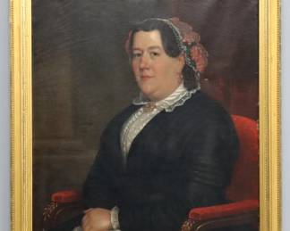 Frederick R. Spencer, American, 1826-1875.  A mid 19th century oil on canvas portrait of a lady.  Depicted half length seated in a Red upholstered chair wearing a Black dress with Lace cap and shirt.  Signed "Painted by F.R. Spencer" at canvas verso.  Some craquelure and surface grunge, small puncture mid right, a few flakes to paint, abrasions along right edge.  Image 26 1/2 x 33 1/2" high, in a Gilded wood frame with minor damage, 31 2/ x 38 1/2" high overall.  
