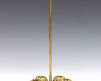 An early 20th century Tiffany Studios Bronze flower holder.  Five lotus form bud vase holders on a circular foot with slender stem.  Impressed "Tiffany Studio New York" and "722" at underside.  Lacks glass inserts, some wear to original Gilded patina.  8 1/2" high.  
