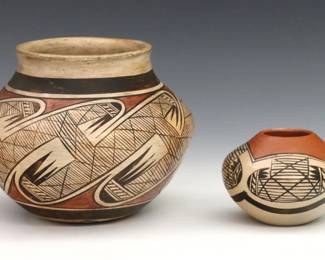 Two late 20th century Hopi Earthenware jars by Fannie (1900-1987) and Miriam (b. 1954) Nampeyo.  Each with bulbous form and geometric polychrome decoration.  Larger signed "Fannie Nampeyo" and smaller "Miriam Nampeyo" at undersides.  Some wear to decoration, particularly to the larger.  Up to 5 1/2" diameter x 4 1/2" high overall.  
