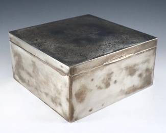 A turn of the century American Sterling Silver box.  Square hinged box with floral engraved lid and velvet lined interior.  Partial maker's mark, possibly Gorham, with "Sterling" and "B 3519".  Some surface wear and minor denting, monogrammed.  6 1/2 x 6 1/2 x 3 1/4" high overall.  
