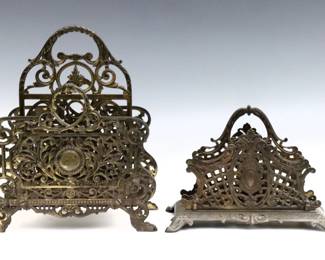 Two early 20th century Bradley Hubbard letter racks.  Scrolled Cast Iron frames with two letter compartments.  Smaller marked "B&H 1913", the larger attributed to B & H model #3572 with replaced base plate.  Wear to original Gilded patina.  Up to 10 1/2 x 6 1/4 x 12 1/2" high. 
