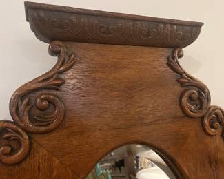 Carving on vintage oak hall tree