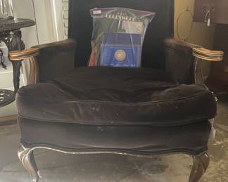 One of two brown velvet side chairs