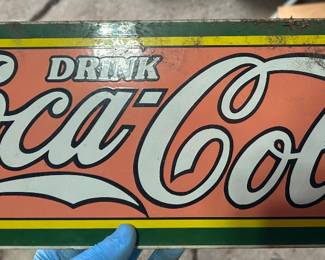 Small Coca-Cola sign. Faded