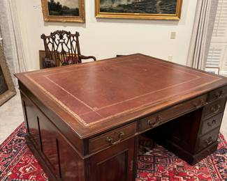 Antique 19th Century double sided Partner’s Desk, mahogany with leather top,  60” wide by 48” deep by 29” high.  This desk easily separates into three pieces for moving.  Excellent condition. 