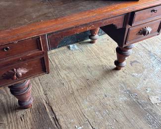 Large slant leather top desk. Will not be in-the house. It won’t fit through the door