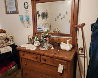 Antique dresser with mirror.  Wooden crutch. 