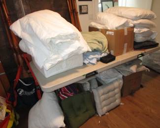 Tons of bedding/linens. Down comforters, mostly new