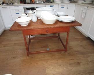 Antique table with some white pottery
