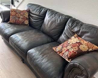 We have many other high-end furniture pieces and decor items available High-Quality Leather Sofa - Hemispheres Furniture,Beautiful dark brown leather sofa purchased from Hemispheres Furniture. High-quality craftsmanship with classic nailhead trim. Excellent condition, with minimal wear. Perfect for any living room.
Dimensions:
33*78*36 seat height 19