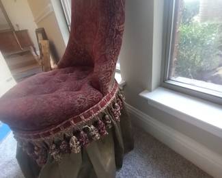 we're offering this elegant vintage red accent chair for sale. Its unique design and vibrant color make it a perfect statement piece for any room. The chair is in good condition, offering both comfort and style.