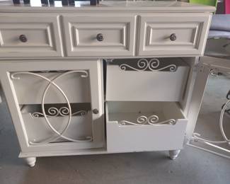 Solid wood construction for durability
Decorative metal accents on the doors
Two drawers and bottom storage compartment .Width: 3ft 2in, Length: 1ft 7in, Height: 3ft