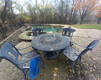 here is a table and other garden essentials in the garden