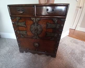 These are four beautifully crafted antique-style boxes, directly imported from Asia, showcasing traditional Oriental designs. The collection features two unique designs with two boxes of each style. Made from sturdy wood with intricate brass/bronze hardware, these boxes are perfect as decorative accents or functional storage solutions. The exceptional craftsmanship and elegant details make them a valuable addition to any home. 4 boxes