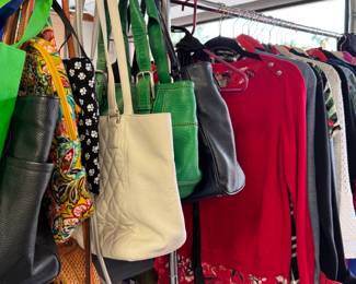 assorted leather and cloth handbags with a Vera Bradley back pack