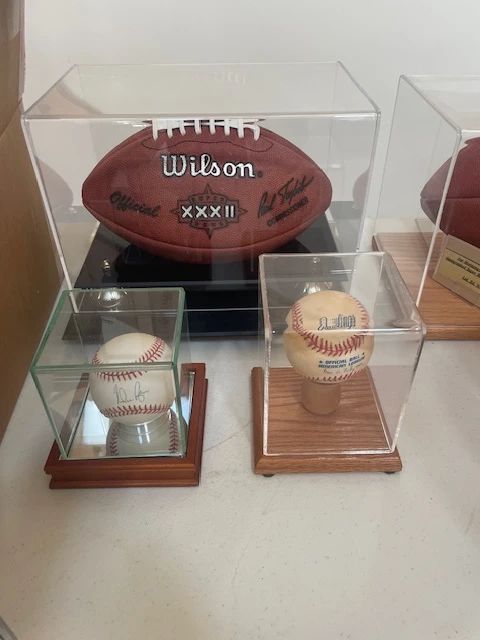 Official Superbowl XXXII football, Nolan Ryan autographed baseball, official all star game ball Fenway