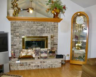 Howard Miller Oak Eternity Floor Clock with glass display shelving: 27" x 13" x 84" &nbsp;$495 Please contact Diana via text or phone 708-670-2189 to arrange&nbsp;payment or with any questions.&nbsp;