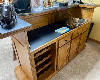 Oak bar with dry sink, black formica top, a 2 door cabinet and drawer and oak back bar, storage for stem ware, mirror back, 2 bar height stools: Sold all together $995 Please contact Diana via text or phone 708-670-2189 to arrange&nbsp;payment or with any questions.&nbsp;
