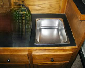 Oak bar with dry sink, black formica top, a 2 door cabinet and drawer and oak back bar, storage for stem ware, mirror back, 2 bar height stools: Sold all together $995 Please contact Diana via text or phone 708-670-2189 to arrange&nbsp;payment or with any questions.&nbsp;
