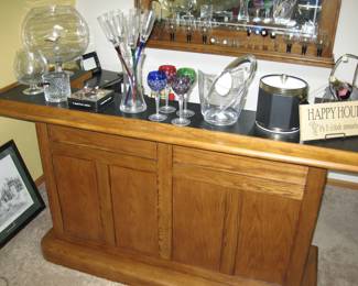Oak bar with dry sink, black formica top, a 2 door cabinet and drawer and oak back bar, storage for stem ware, mirror back, 2 bar height stools: Sold all together $995 Please contact Diana via text or phone 708-670-2189 to arrange&nbsp;payment or with any questions.&nbsp;
