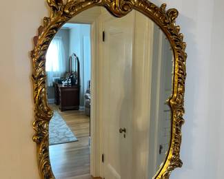 Vintage carved gold wall mirror.