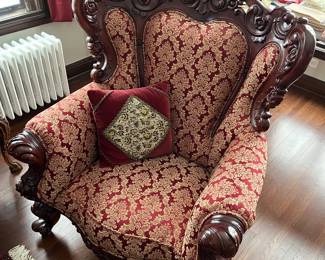 One of two matching antique wood carved chairs. Chairs match sofa shown in previous photo.