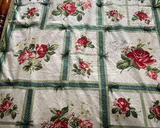 Quilt with rose motif.