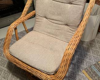 One of three matching vintage rattan chairs.