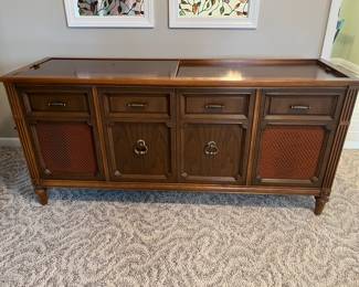 Mid-century stereo console with Magnavox Astro-Sonic stereo and turntable.