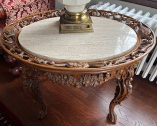 Antique hand-carved oval marble-top side table.