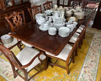 Dining table with eight chairs and two leaves (one leaf boxed and not shown),