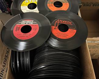 Large collection of 45 rpm records.