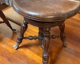 Antique piano stools with claw and ball feet