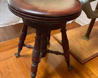 Antique piano stools with claw and ball feet