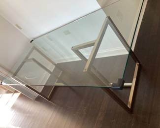 Glass top with brass bases dining table 80" L x 36" D x 29" H