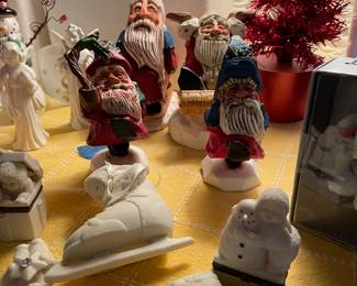 Snow babies and wood carved Santa’s by David Frykman