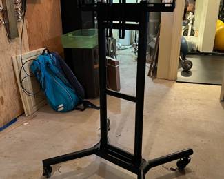 133. Adjustable Presentation or TV Stand on Casters