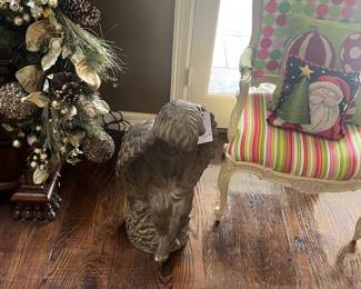 A fun chair with some fun fabrics ,,large cherub statue