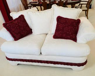 White Loveseat w/Burgundy Braid & Pillows