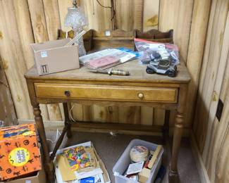 vintage desk with attached metal lamp