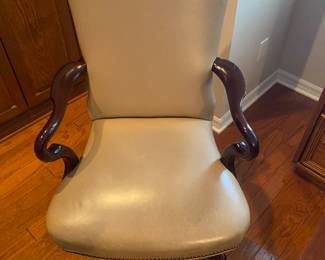 Nice leather office chair with mahogany arms and studded back
