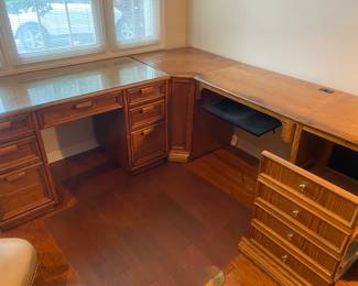 The left side is a very nice wood desk with glass top.  Rattan accents on the drawer fronts on the top.