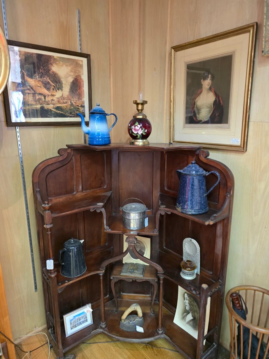 Corner Hutch
This is a corner hutch, a piece of furniture designed to fit snugly into a corner of a room.
44" wide, 30" deep, 53" tall
It can be used to display china, glassware, collectibles, or store items like serving bowls or kitchen supplies.