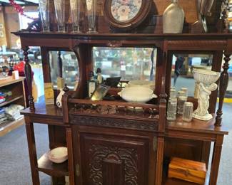 Carved Rosewood Sideboard Cabinet
Mirror and Intricate Carvings
Has a door and lots of shelves
51.5" wide, 14" deep, 55" tall