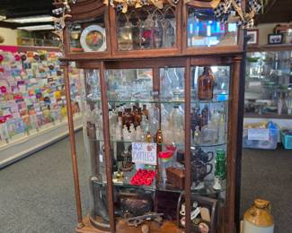 Curved Glass Cabinet
used to showcase items while protecting them.
This particular cabinet has curved 
glass sides, glass shelves and we do have the doors. All in great condition. 
72" tall, 47.5" wide, 15" deep
$480